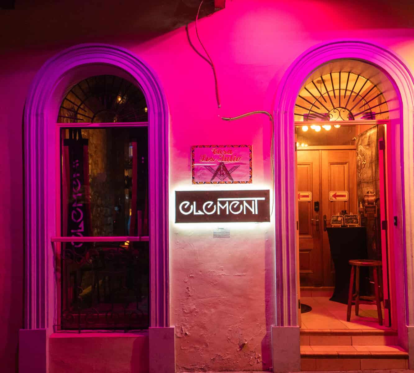 Exterior entrance of Element Bar Casco Viejo illuminated at night