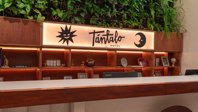 Front desk at Tantalo Hotel in Casco Viejo Panama with illuminated logo and modern reception design