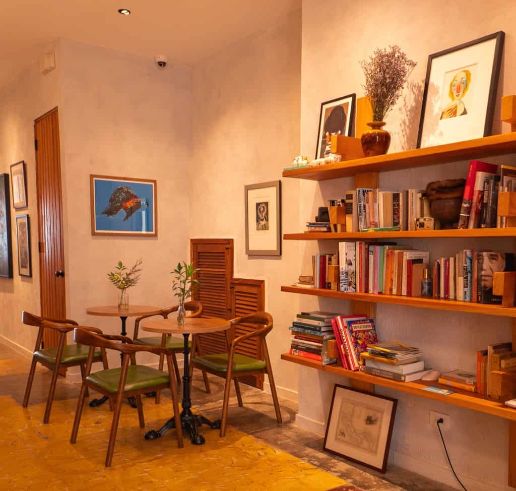 Casco Viejo coffee house interior at Olympia Coffee Studio Panama with bookshelves and seating