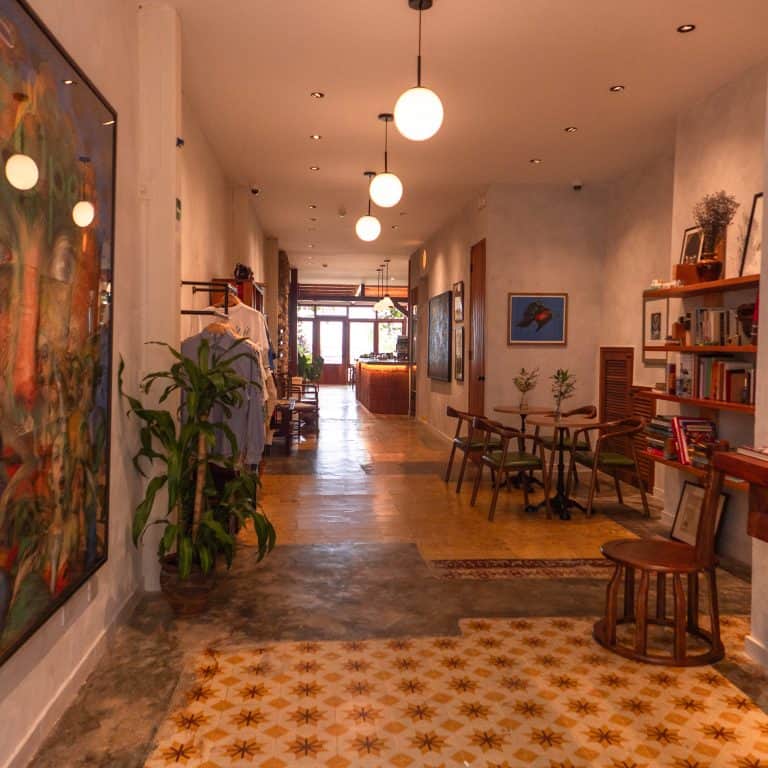 Coffee house interior at Olympia in Casco Viejo Panama with art, seating, and warm lighting