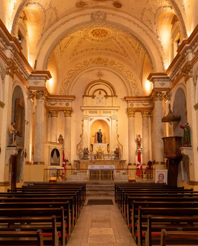 Interior of the historic Oratorio San Felipe Neri church in Casco Viejo, Panama City, featuring the colonial nave, altar, vaulted ceiling, and restored architectural details.