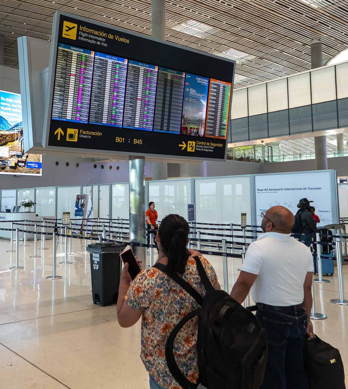 Travelers approaching immigration at Tocumen International Airport in Panama City.