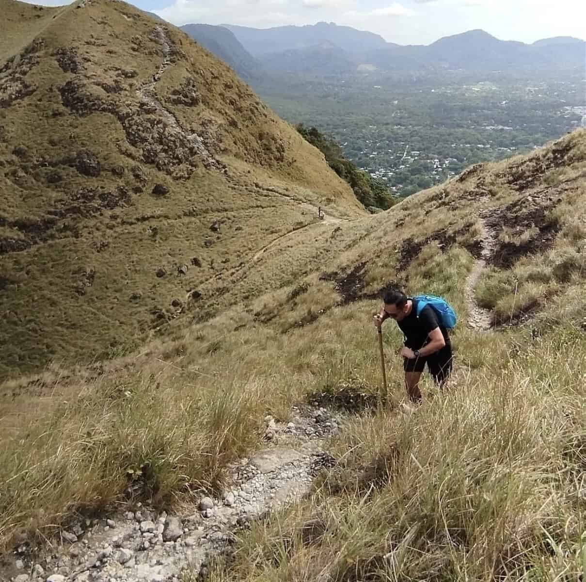 Hiker climbing the La India Dormida mountain trail above El Valle de Antón, Panama.