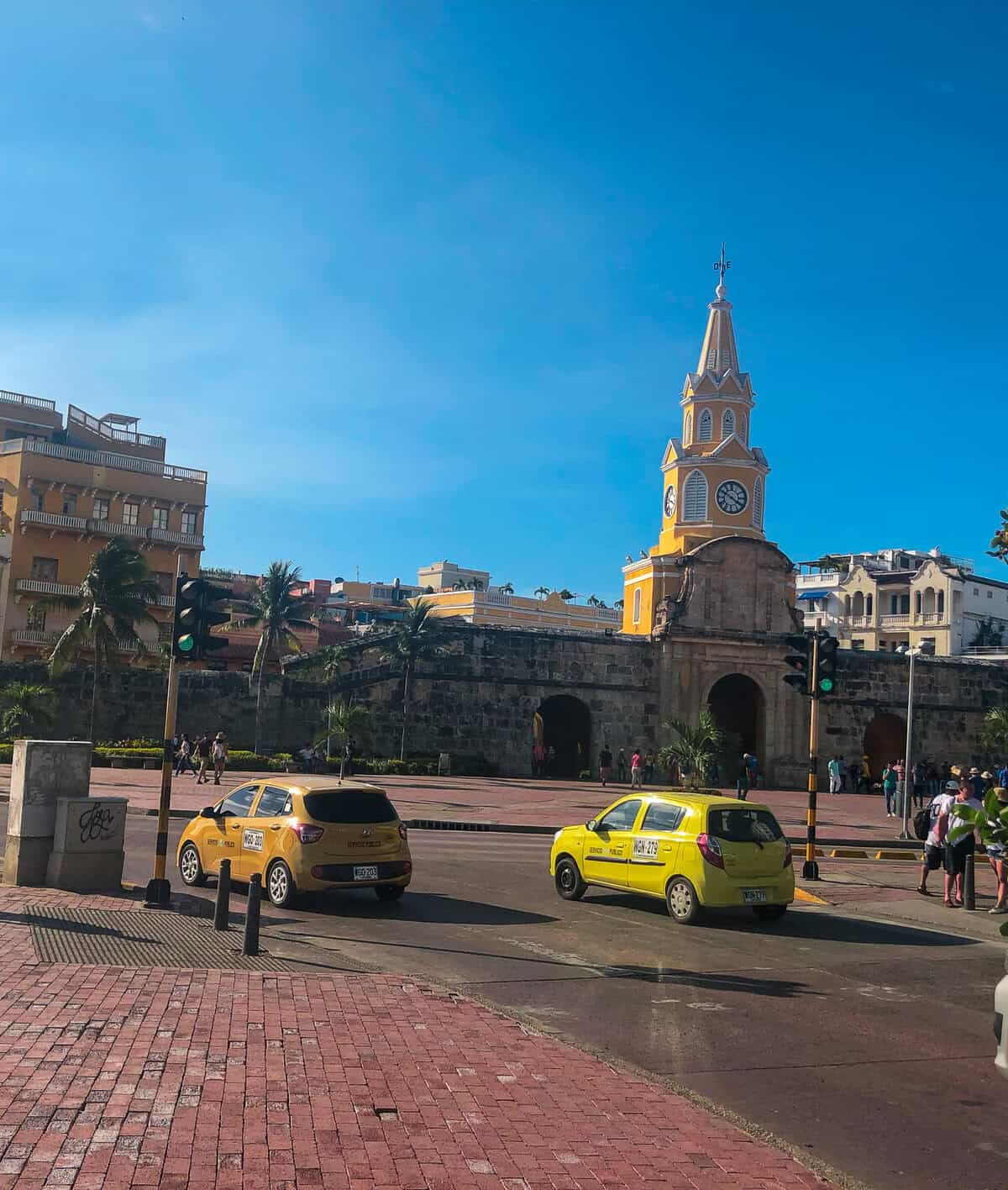 Clock Tower entrance to Cartagena’s historic walled city beneath a bright blue sky.