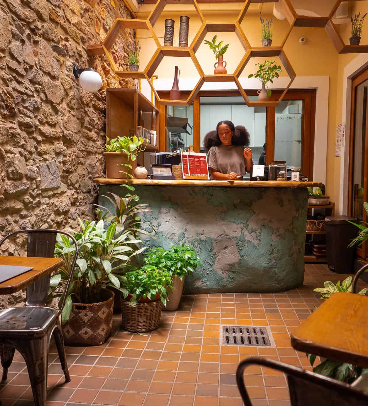 Mia Grenald Sharfi, owner-operator of Vegan Shack, behind the counter inside the plant-based restaurant in Casco Viejo, Panama.