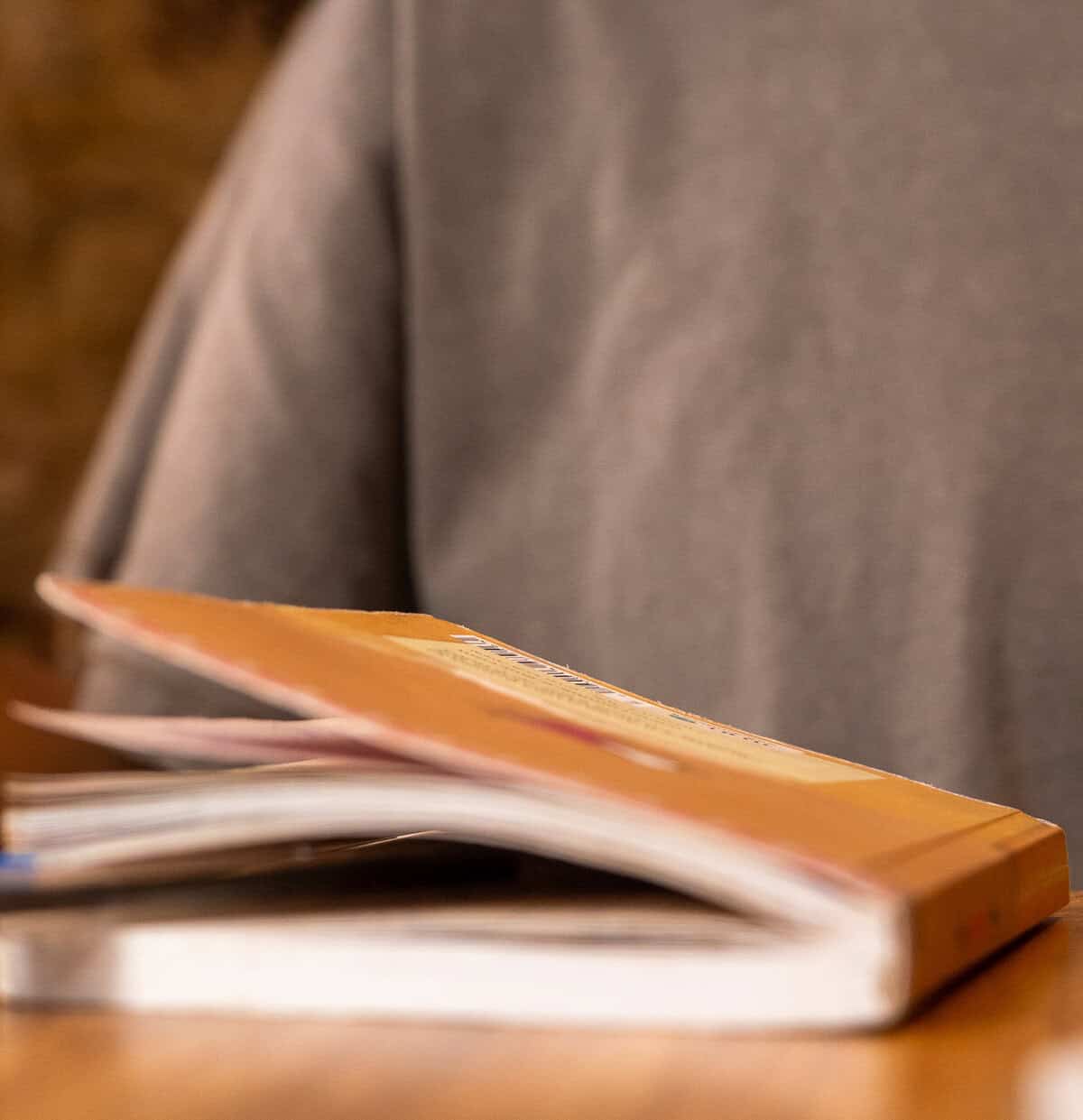 A notebook resting on a wooden table inside Vegan Shack in Casco Viejo, Panama.