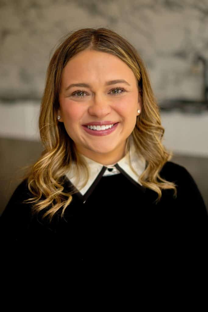Relaxed therapist smiling for calming therapy images.
