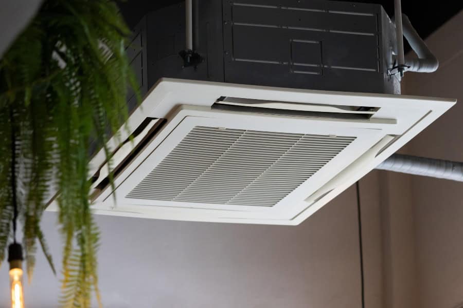 Ceiling-mounted ducted air conditioning unit installed in a modern interior space.