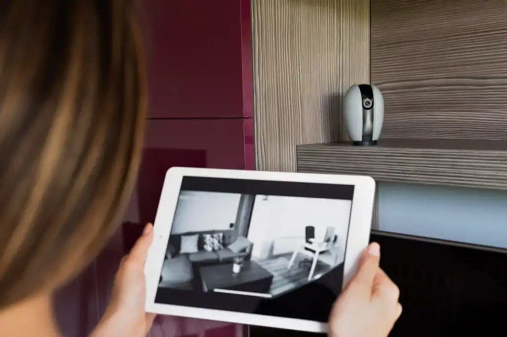 Close up woman checking security camera - ip camera installation dubai