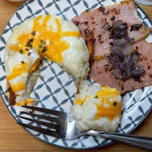 mashed potato nest with baked egg peameal bacon