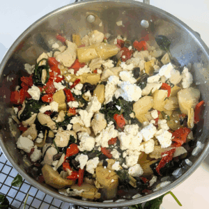 Cooked artichokes with feta cheese and spinach, ready for recipe assembly.