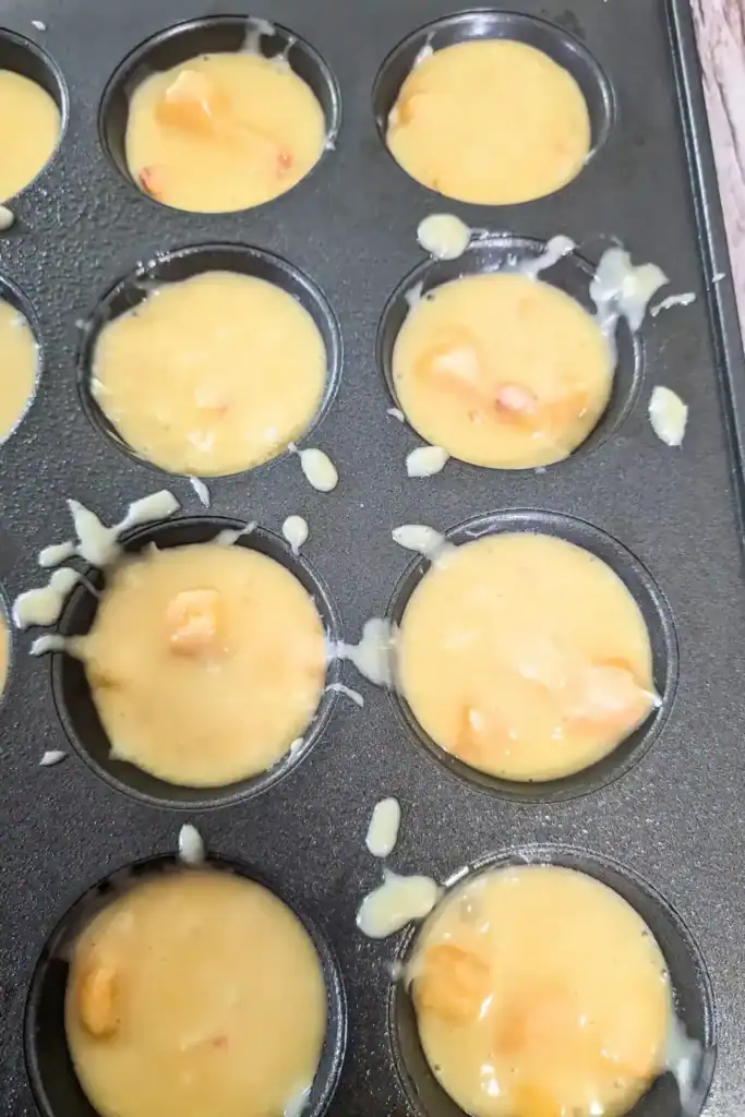 the muffin cups filled to three quarter capacity