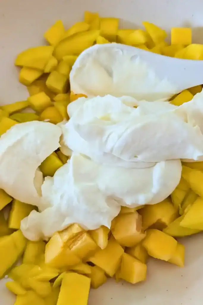 adding orange cream to salad