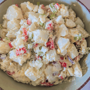 close up potato egg salad in bowl