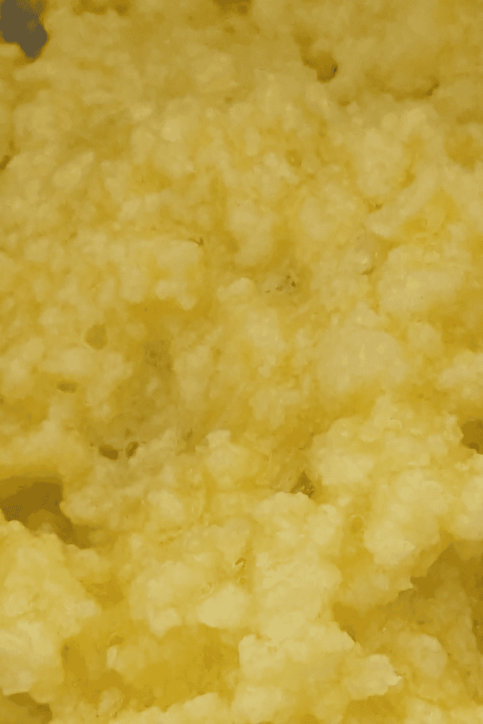 mixing in the egg to butter sugar in cookie dough