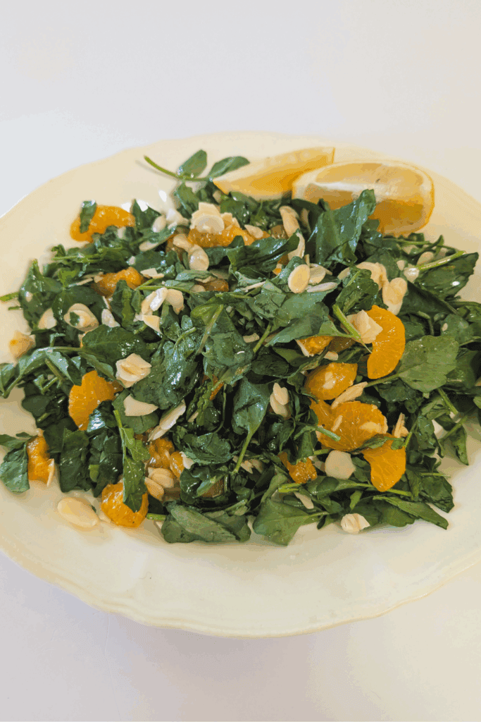 plated salad with almonds and lemon dijon dressing