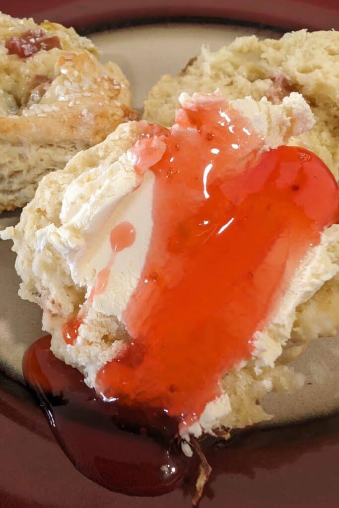 serving scone with clotted cream and jam