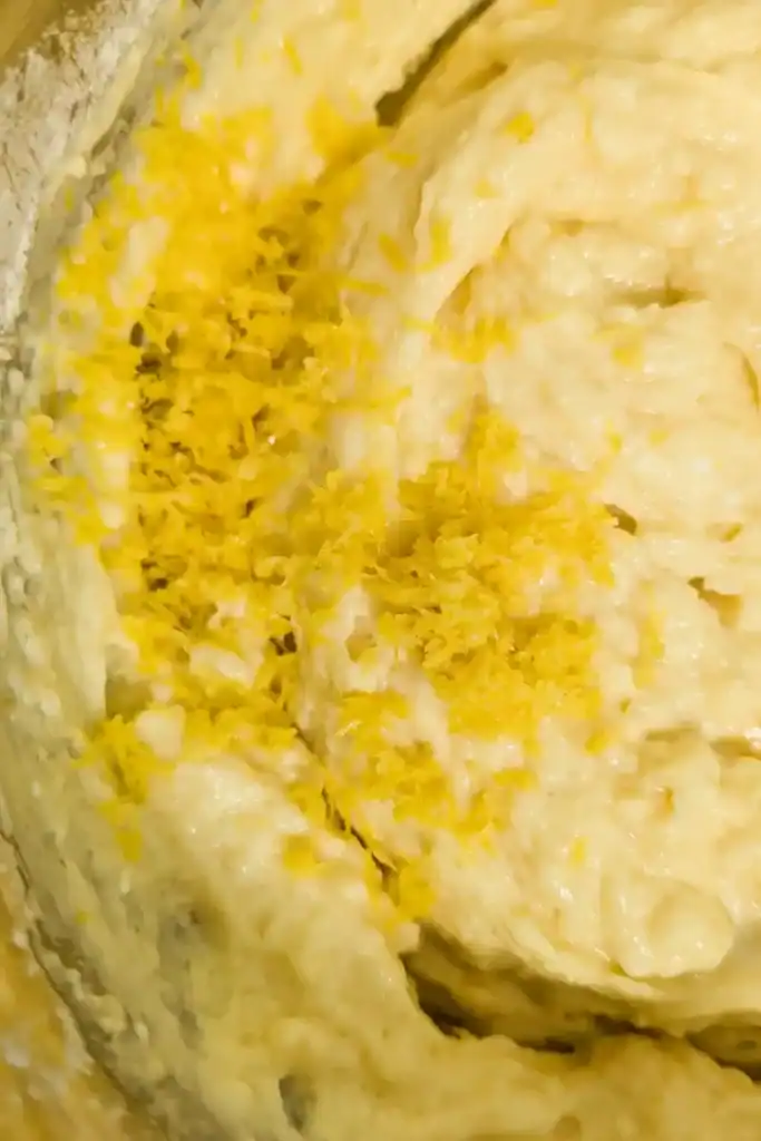 mixing the wet and dry ingredients and adding lemon zest