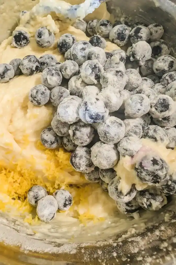 adding the floured blueberries
