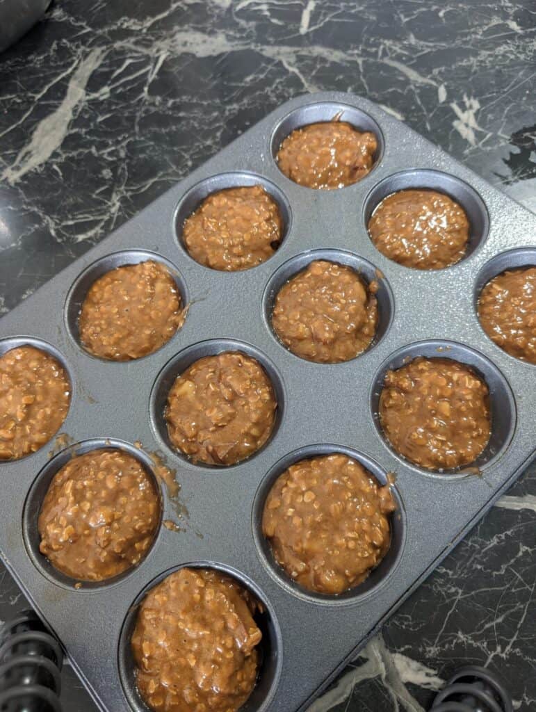 muffin batter in muffin tins