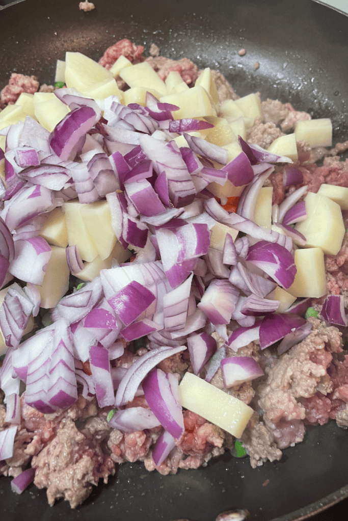 add potatoes and red onion to ground meat filling