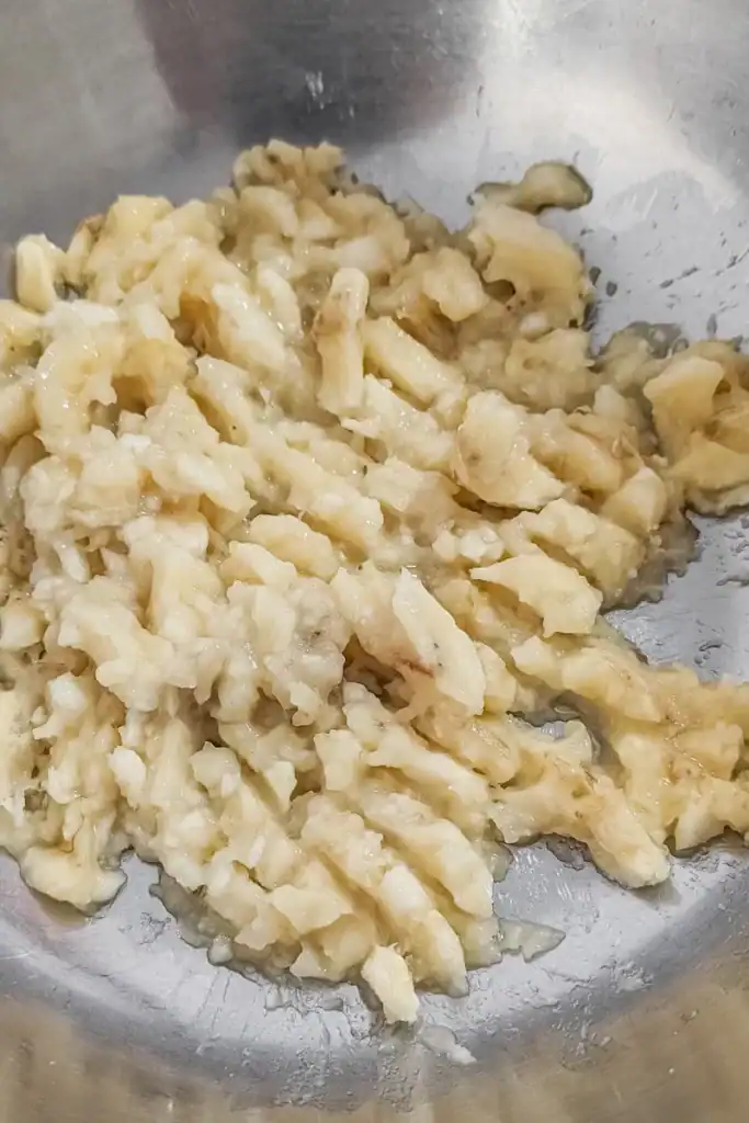 mashing bananas in bowl