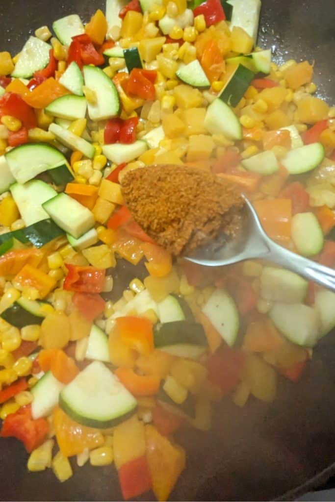 add Old Bay seasoning blend to squash corn succotash