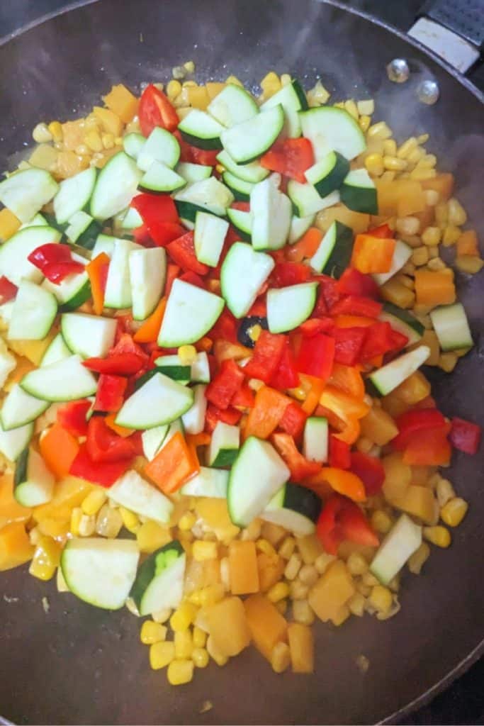 add zucchini and peppers to corn and butternut squash