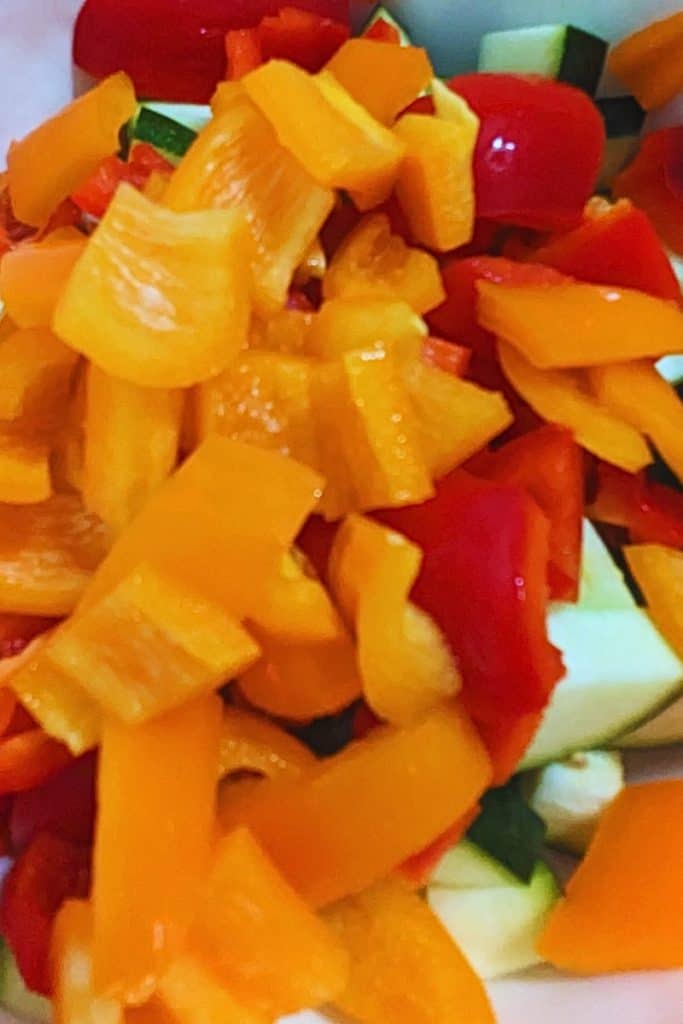 chop red and orange peppers