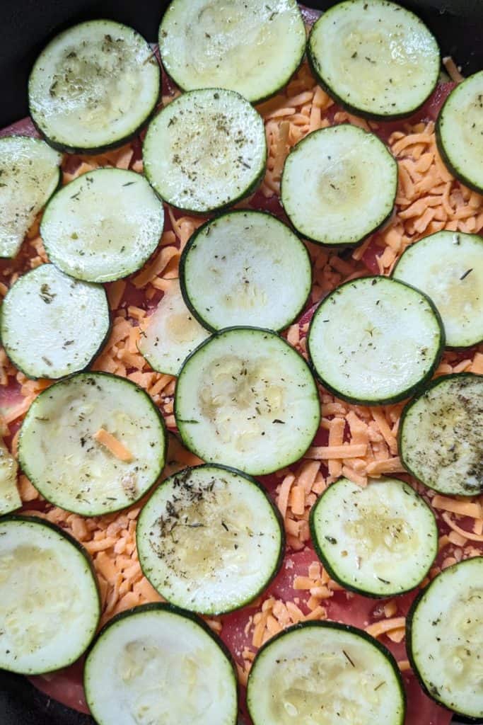 layering more zucchini on cheese