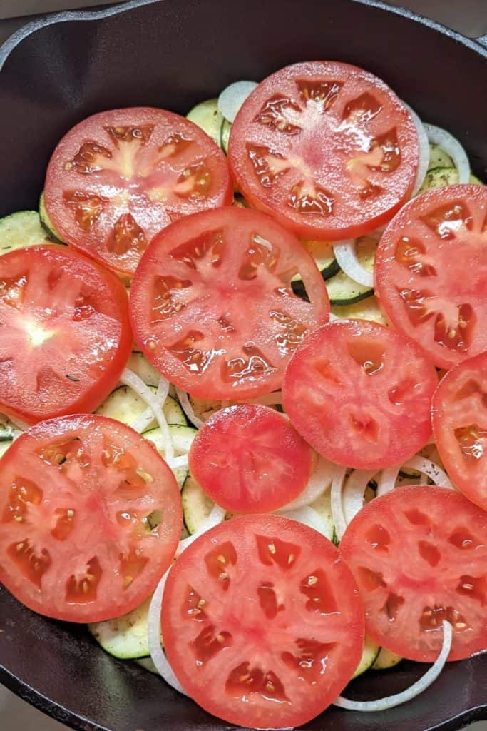 layering tomato on onion