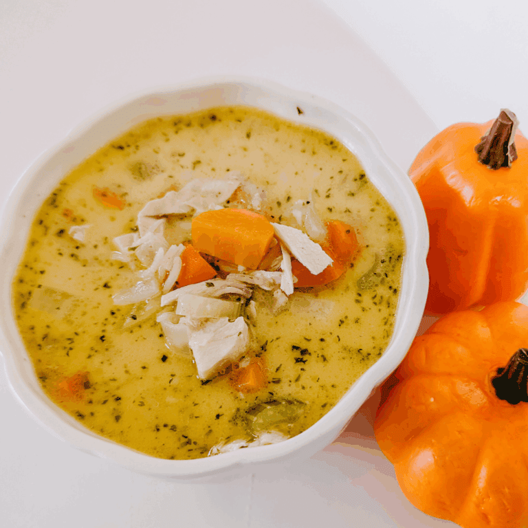 Creamy chicken and vegetable soup with pumpkins, perfect for fall cooking and comfort food.