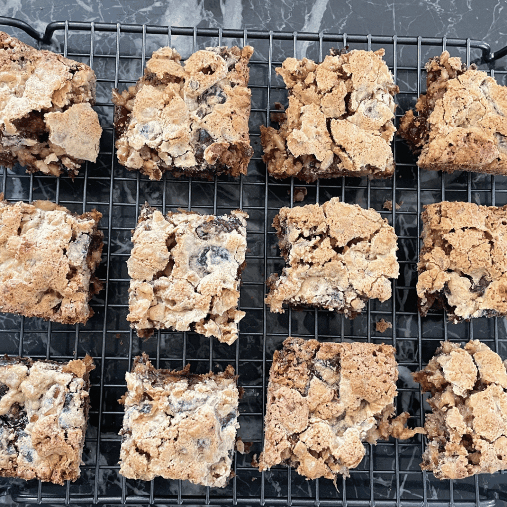 Delicious homemade chocolate chip cookie bars on a cooling rack. Perfect for sweet snack cravings and baking lovers.