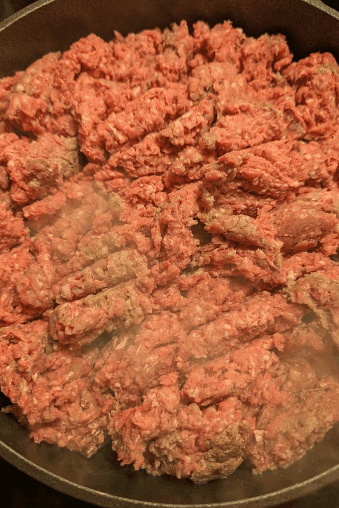 Ground beef cooking in a skillet, ideal for delicious meal preparation.