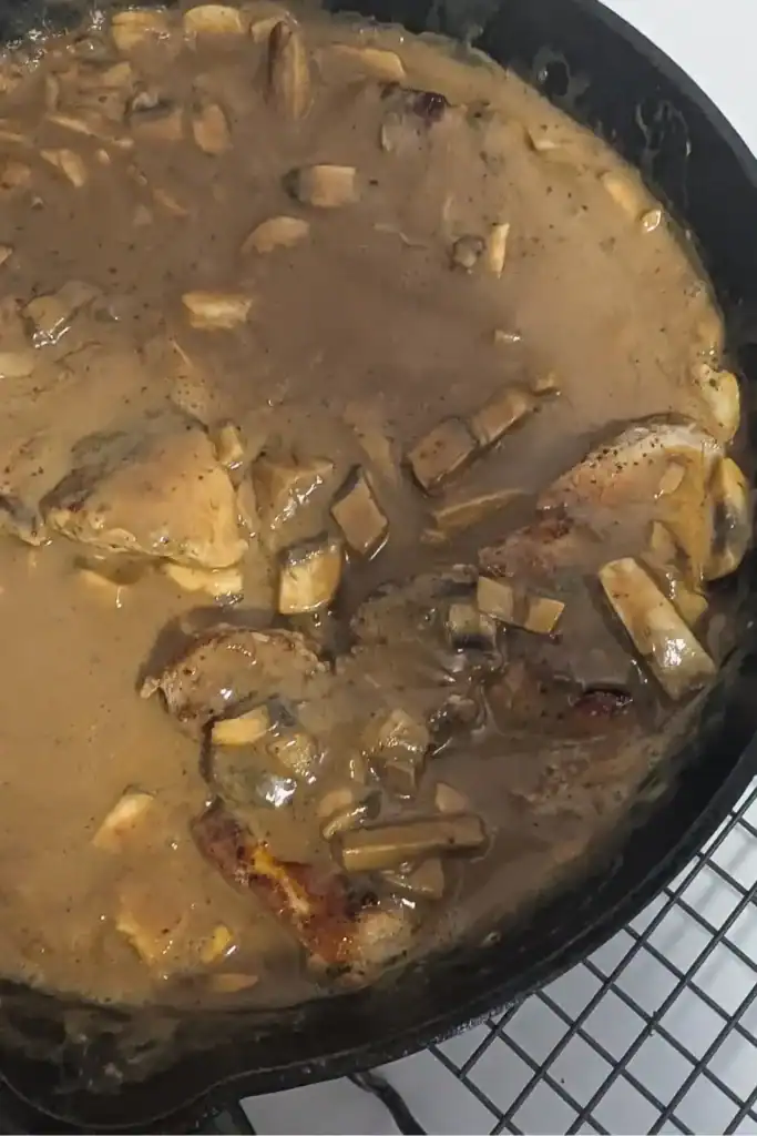 serving the chops in rich brown mushroom gravy