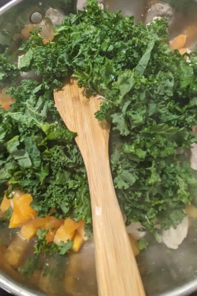 add chopped kale to butternut squash and chicken