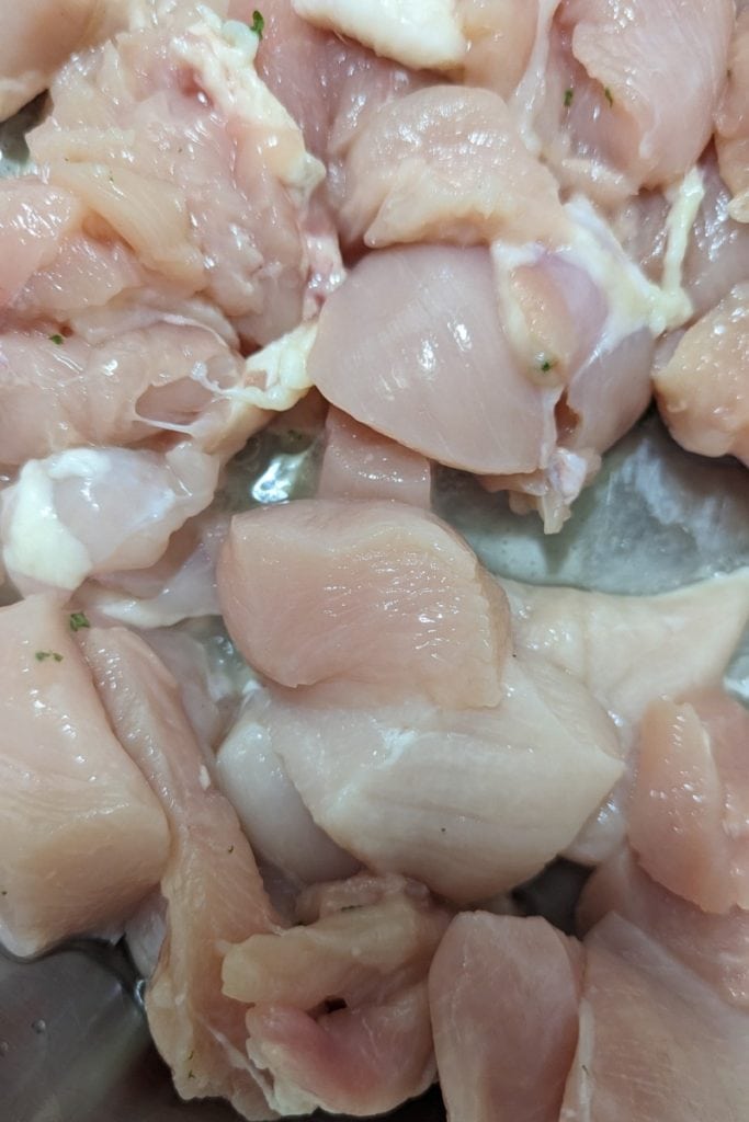add cut up bonelss skinless chicken breast to hot pan