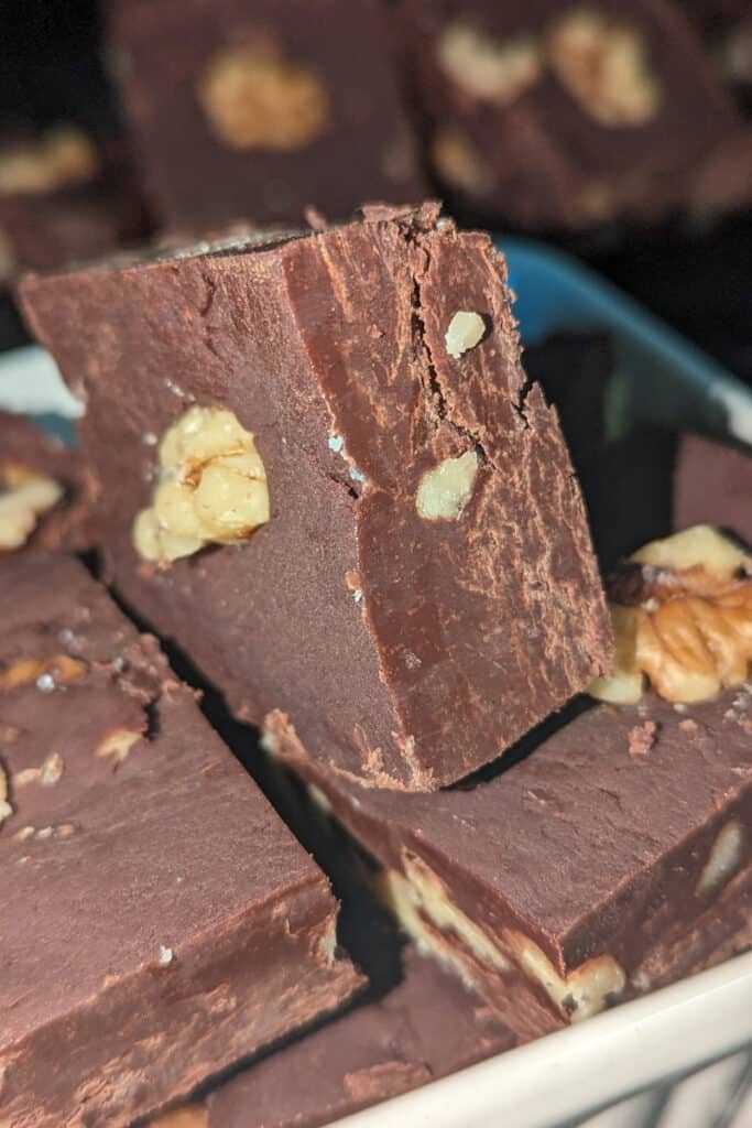 cut harden semi-sweet chocolate walnut fudge into pieces (2)