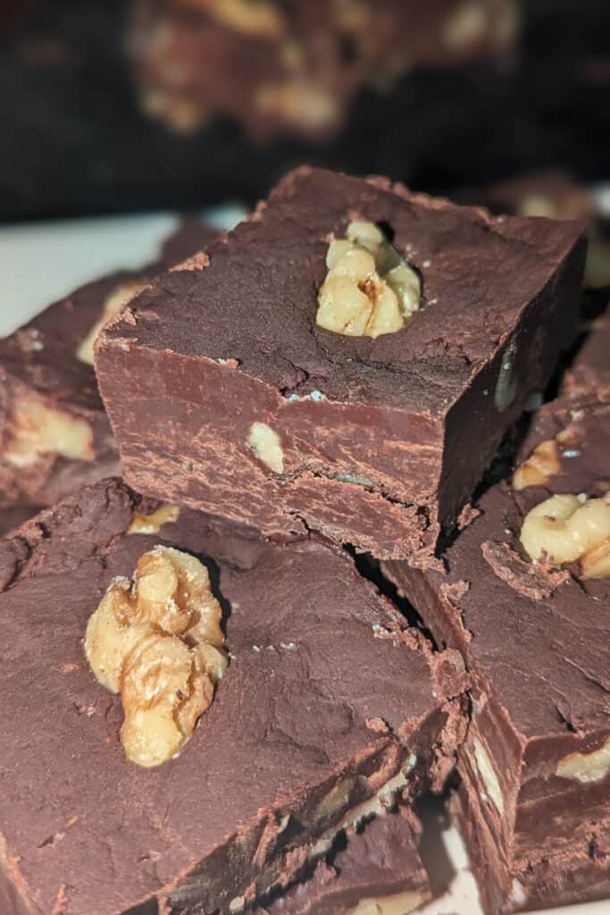 cut harden semi-sweet chocolate walnut fudge into pieces