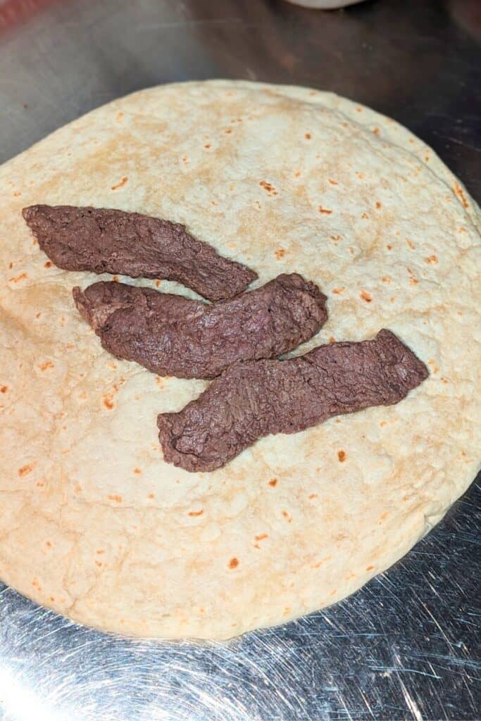 add strips of sirloin steak to wrap