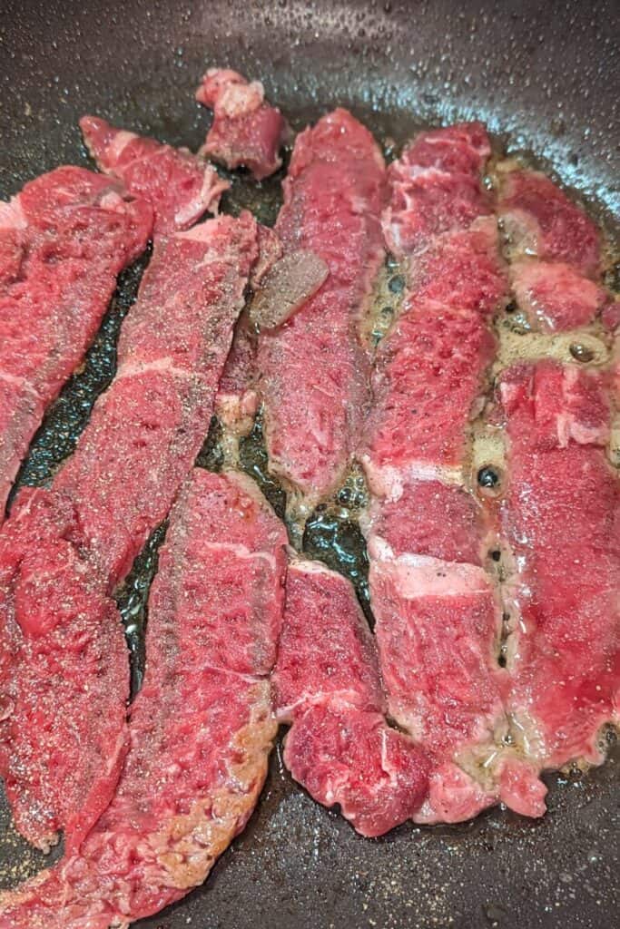 cook sirloin strips in oil in batches