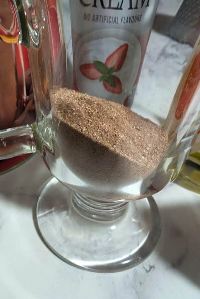 adding half and half creamer to hot chocolate