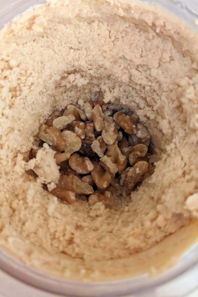 adding chopped walnuts to ice cream