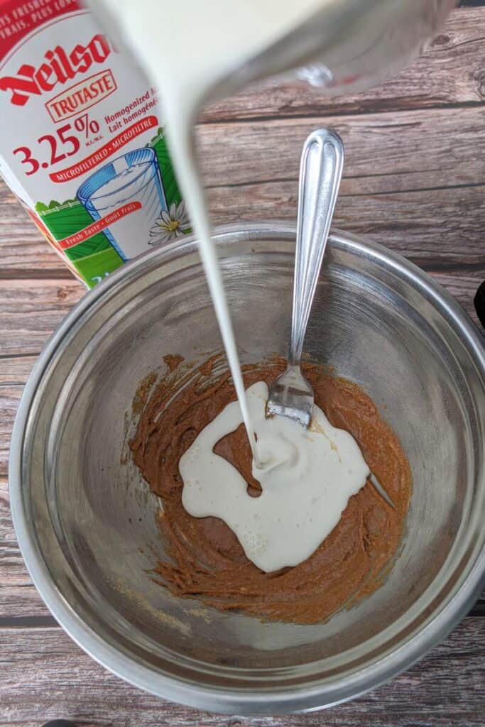 adding whipping cream to sugar ice cream base