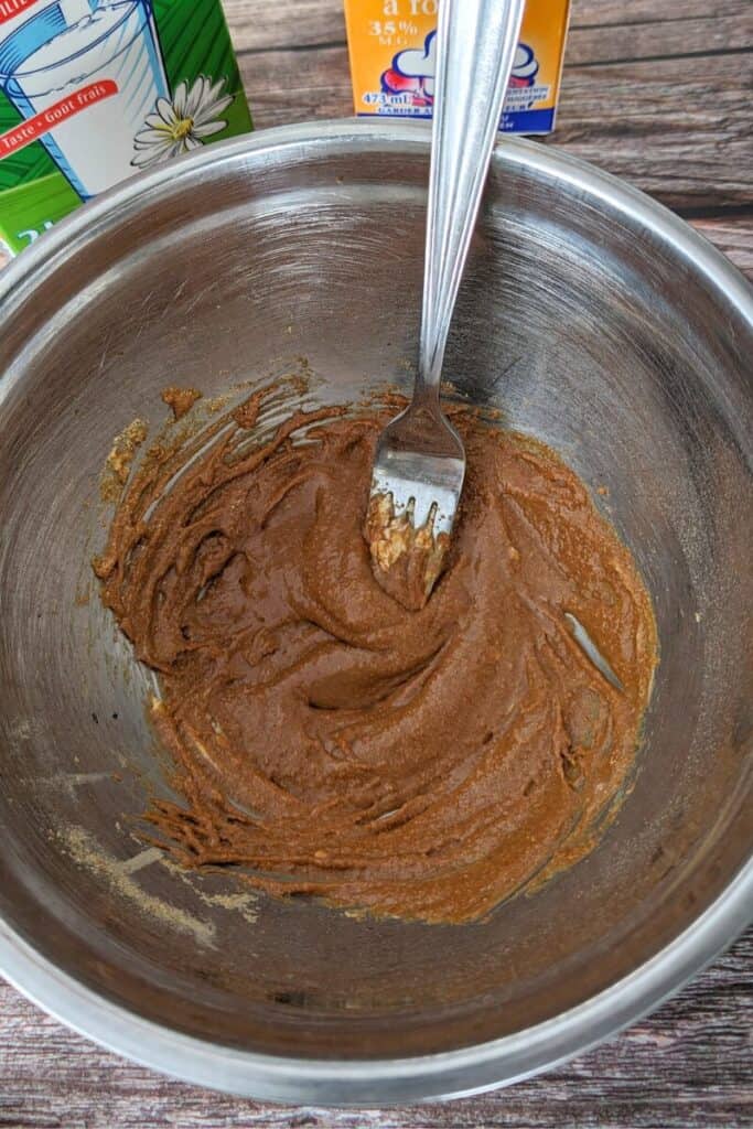 mixing the sugar and cream cheese to ice cream base