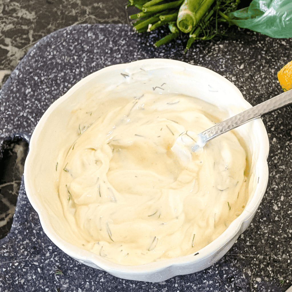 Herb dip with fresh herbs and lemon, perfect for snacks and parties.