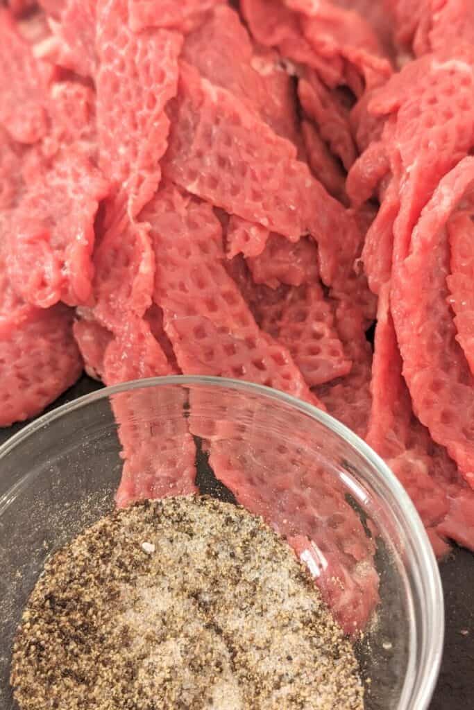 pounded steak strips and seasoning blend