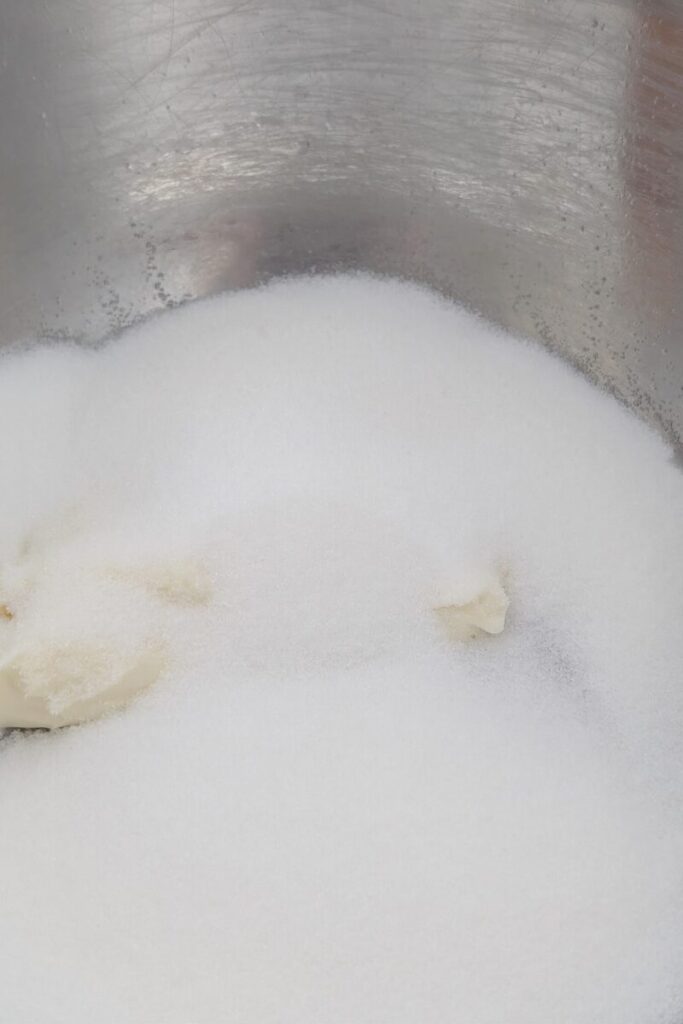 adding sugar to cream cheese