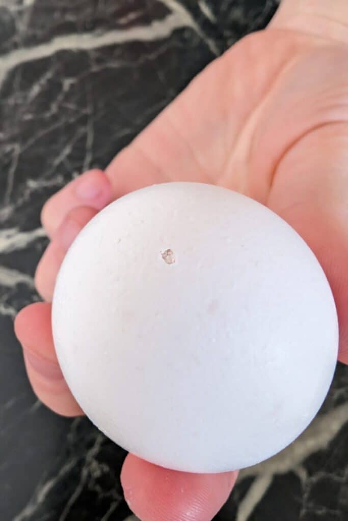tapped small hole in large egg end