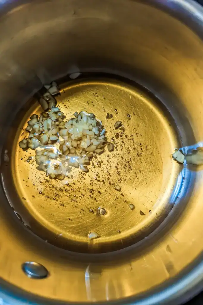 adding honey to saucepan